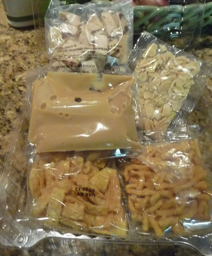 dressing, wontons, noodles, almonds and chicken