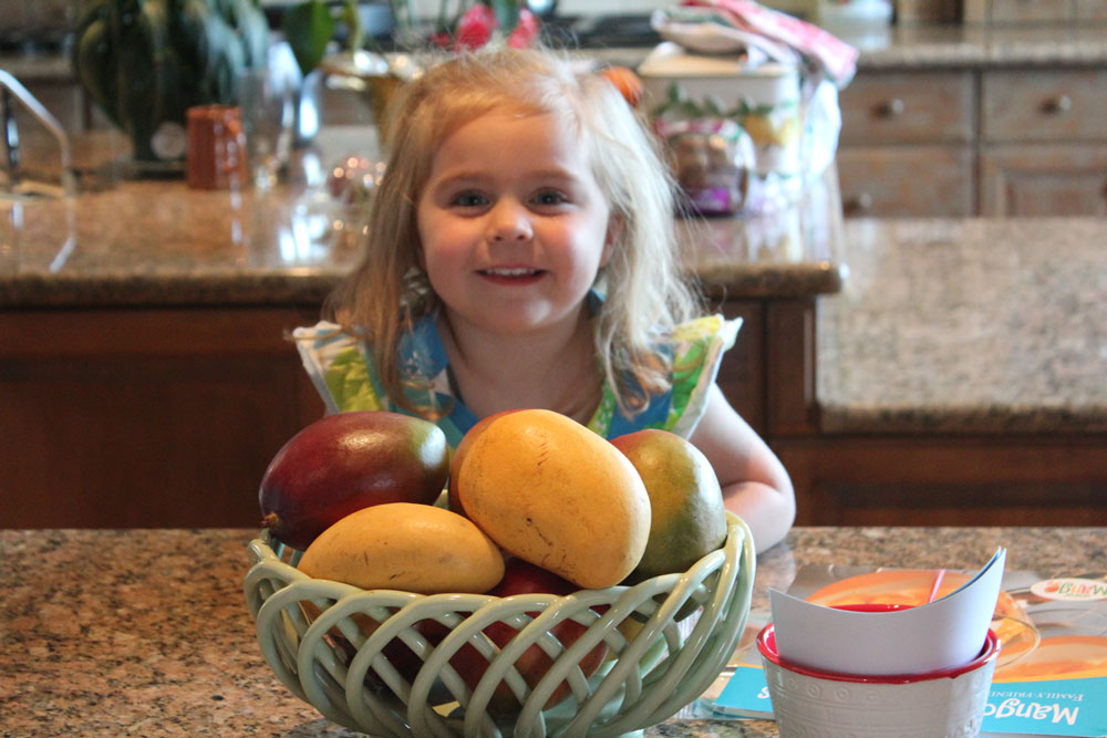 Mangoes and little girl