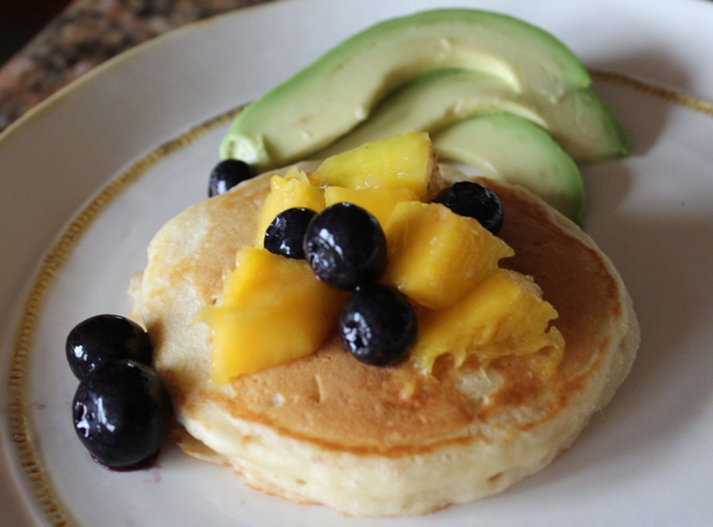 Pancakes with mango, blueberries and avocado