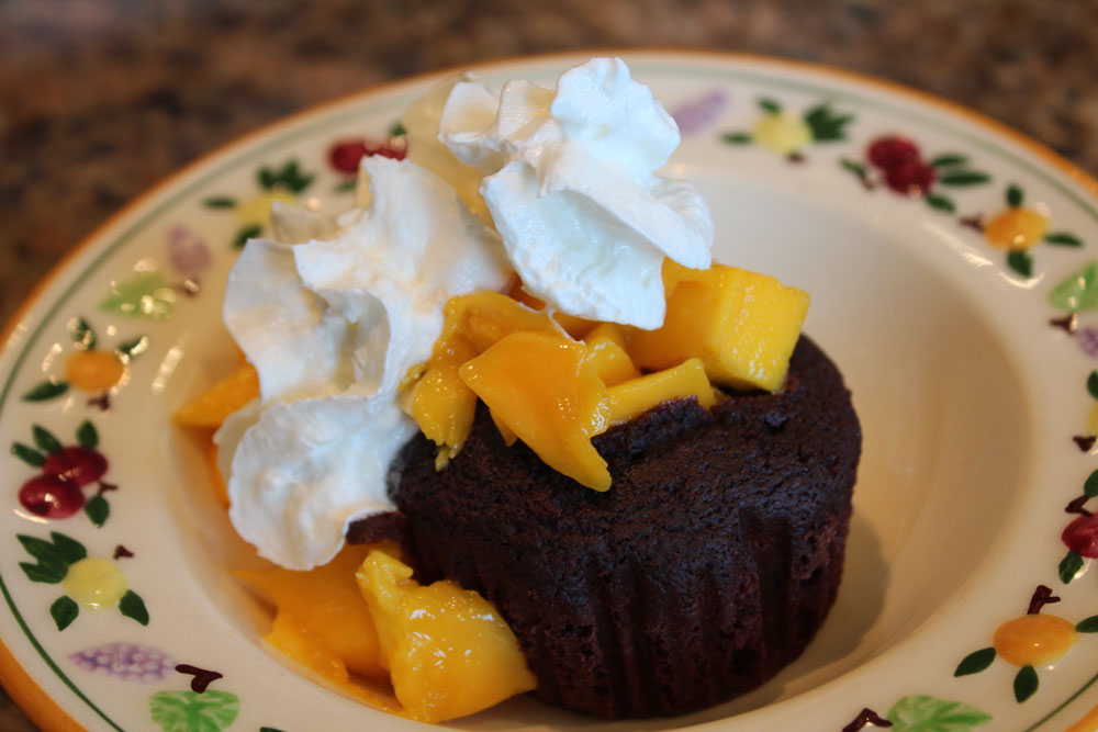mangoes with whipped cream in avocado chocolate cupcakes