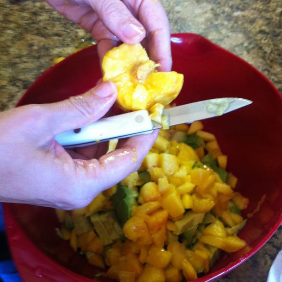 cutting up fruit for the salsa