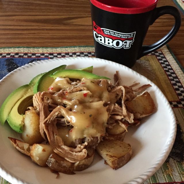 Pulled pork served over country fried Idaho potatoes and topped with Cabot Tomato Basil Cheddar, avocado on the side.