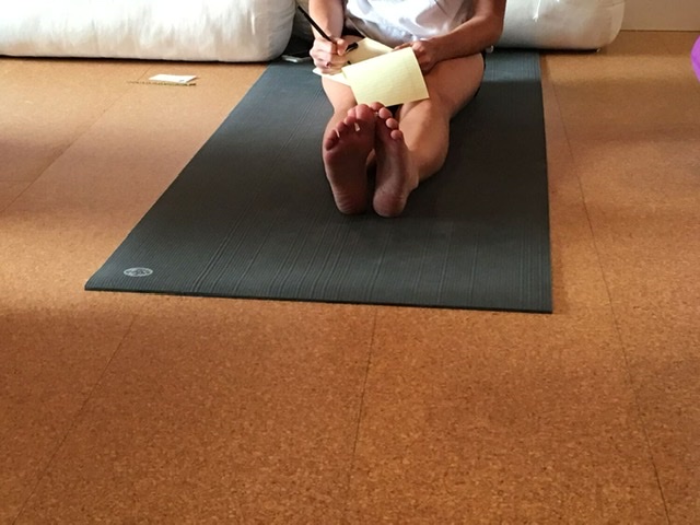 journaling on a yoga mat